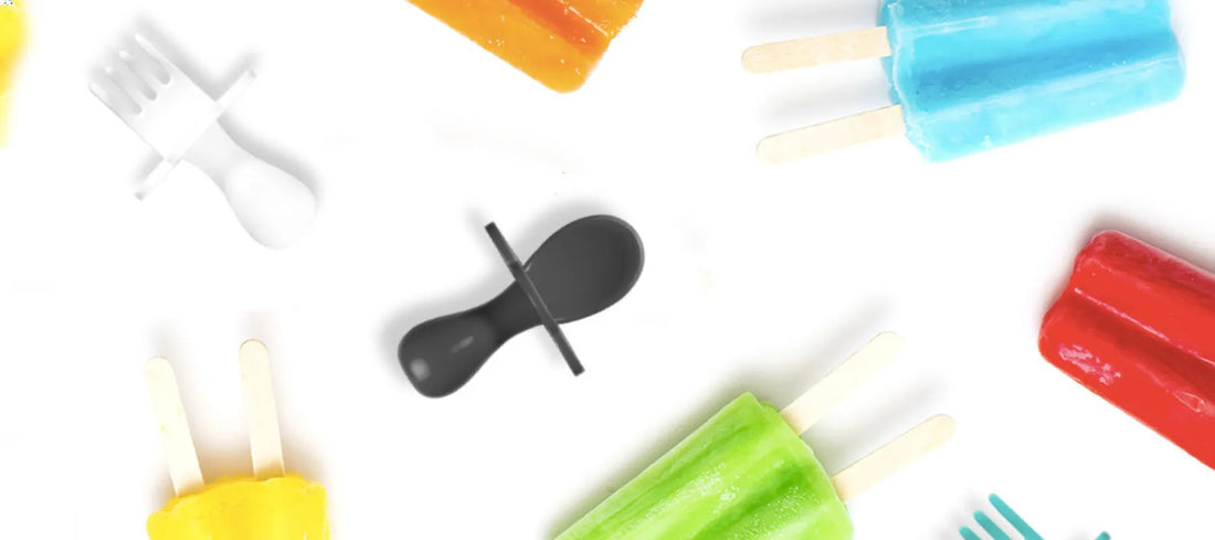 grabease spoons and forks laying in-between icy poles.